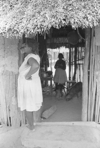 Woman standing at the front door, San Basilio de Palenque, 1976