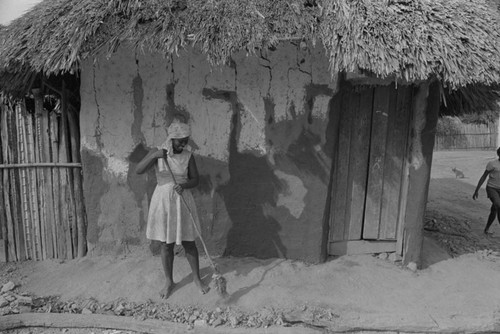 Woman sweeping the floor, San Basilio de Palenque, 1976