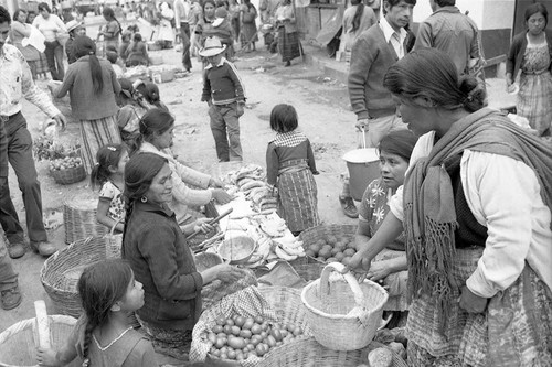 Civilian merchants and customers at the market, Chajul, 1982