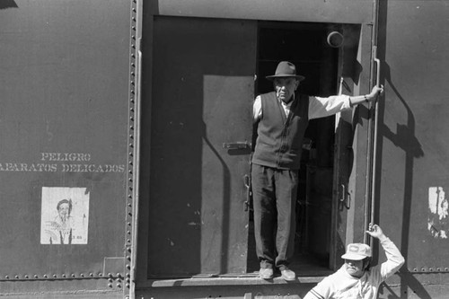 Men on a train car, Mexico, 1983