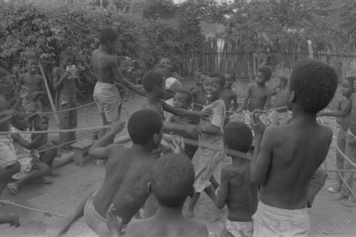 Children cheering inside boxing ring, San Basilio de Palenque, ca. 1978