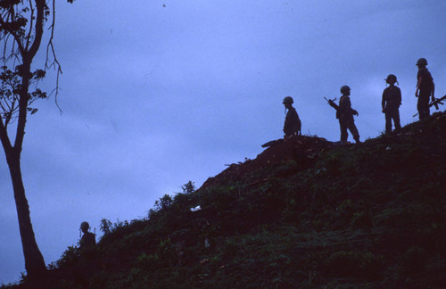 Soldiers stand on hill, Honduras, 1983