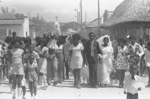 Wedding couple walking in the street, San Basilio de Palenque, 1975