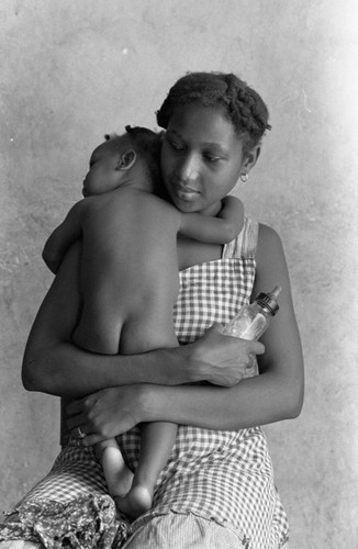 Woman holding a baby, San Basilio de Palenque, 1976