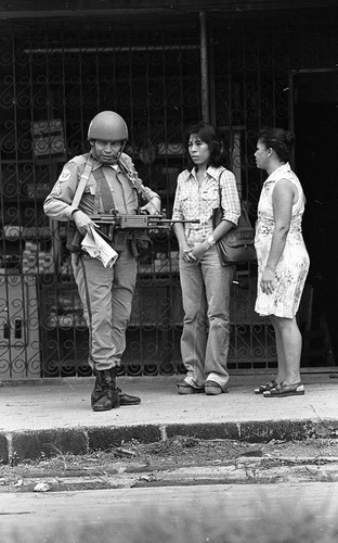 Two women stand near a soldier, Nicaragua, 1979