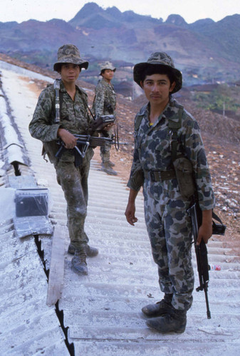 Armed soldiers on a roof, Chajul, 1982