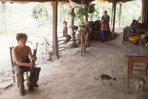 Guerrilla sitting in occupied town, La Palma, 1983