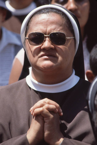 Nun watching Pope John Paul II celebrate Mass, Tegucigalpa, Honduras, 1983