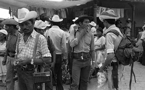 Guerrilleros and civilians socializing, Corinto, Morazán, 1983