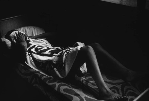 Sandinista woman in bed, Nicaragua, 1979