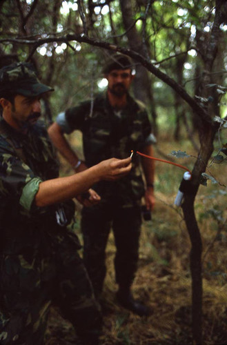 Survival school student learns about explosives, Liberal, 1982