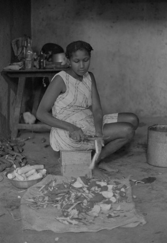 Woman peeling a tuber, San Basilio de Palenque, 1976