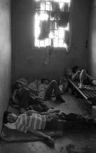 Men sleeping in cell, Nicaragua, 1980