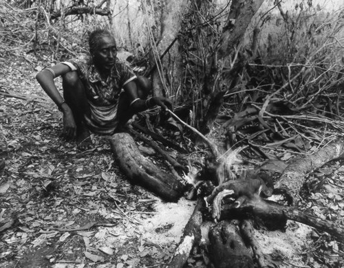 Villager near a fireside, Tanzania, 1979