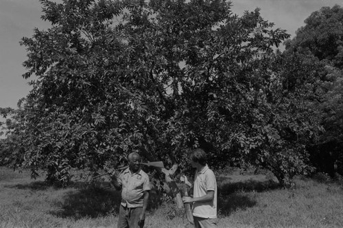 Fermín Herrera and Richard Cross posing together near the woods, San Basilio de Palenque, ca. 1978