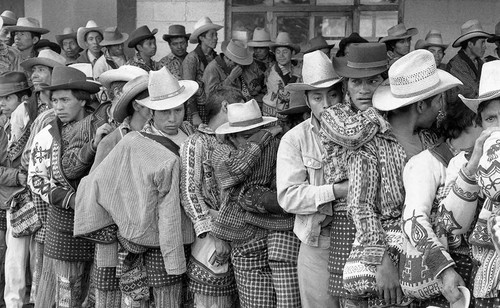 Mayan men in line to vote, Guatemala City, 1982