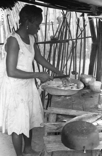 Woman cleaning fish, San Basilio de Palenque, 1975