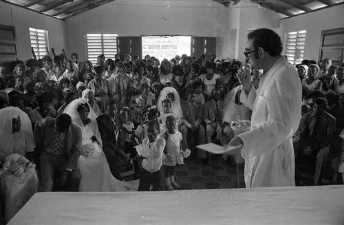 Priest celebrates multiple weddings, San Basilio de Palenque, 1975