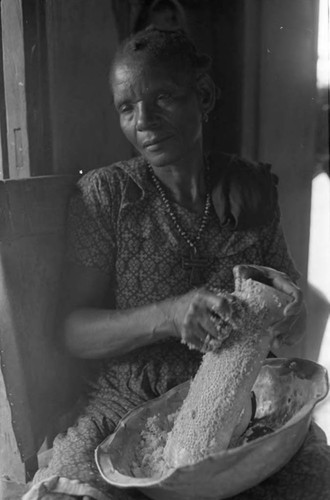 Woman grating coconut, San Basilio de Palenque, 1975