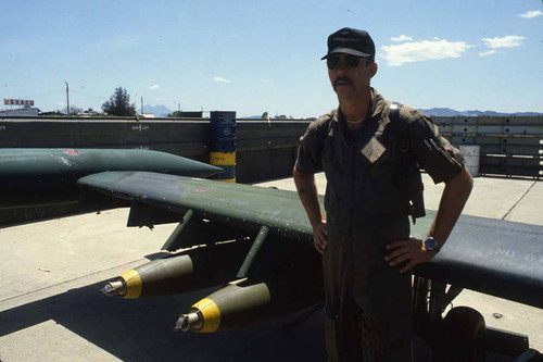 U.S. advisor stands with loaded cessna a-37 dragonfly, Ilopango, San Salvador, 1983