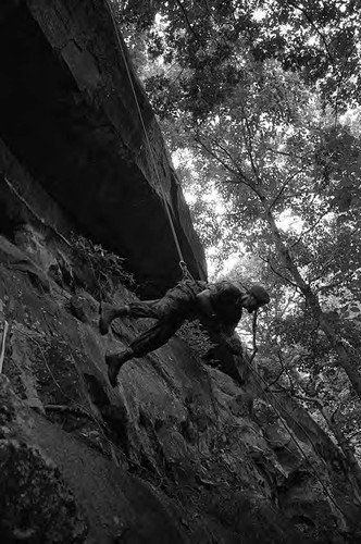 Claflin demonstrates rappelling, Liberal, 1982