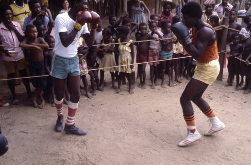 Boxers fighting inside boxing ring, San Basilio de Palenque, 1976