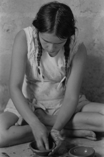 Woman crafting a clay bowl, La Chamba, Colombia, 1975