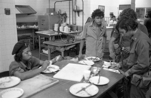 Sandinistas eat at a hotel, Managua, 1979