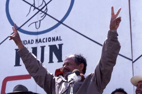 Presidential candidate Ángel Aníbal Guevara making victory signs to crowd of people, Guatemala City, 1982