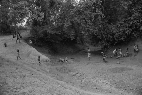 Women and children collecting water at a river, San Basilio de Palenque, 1976