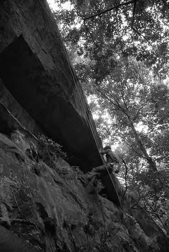 Claflin demonstrates rappelling, Liberal, 1982