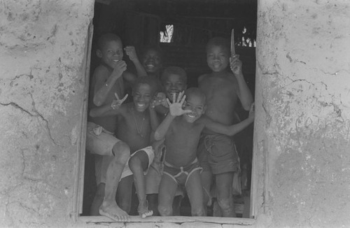 Boys waving from a window, San Basilio de Palenque, ca. 1978