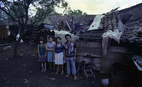 People standing in front of a destroyed home, Managua, 1979