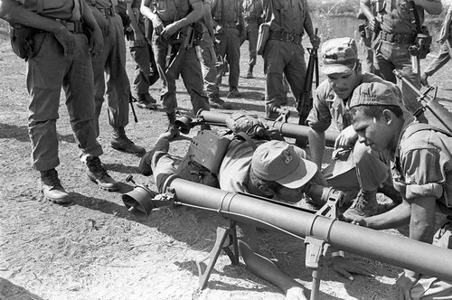 U.S. advisor training Salvadoran soldiers how to use mortars, Ilopango, 1983