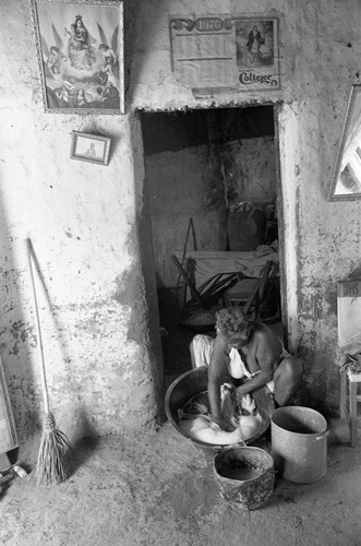 Woman washing clothes, San Basilio de Palenque, 1977