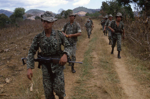 Eight armed soldiers on patrol, Guatemala, 1982