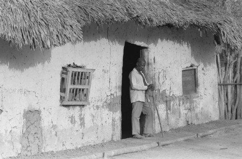 Villager standing in the doorway, San Basilio de Palenque, 1977