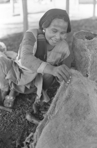 Woman sorting coal, La Guajira, Colombia, 1976