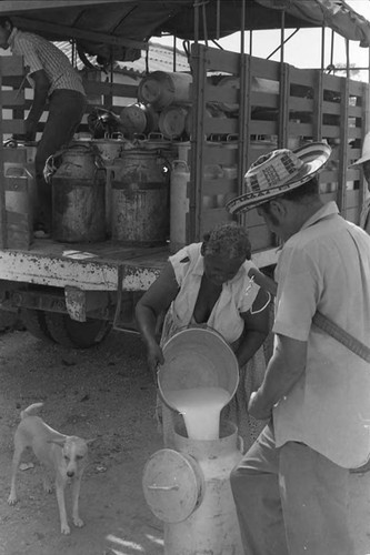 Woman pours milk into a pot, San Basilio de Palenque, 1975