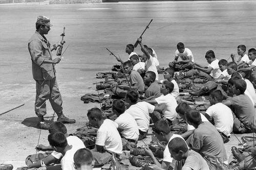 U.S. military advisor training Salvadoran soldiers, Ilopango, 1983