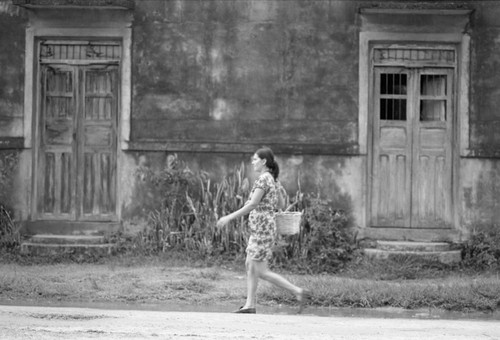 Woman walking down the street, La Chamba, Colombia, 1975