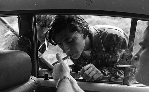 Photojournalist James Nachtwey lights a cigarette for a Sandinista boy, Nicaragua, 1979