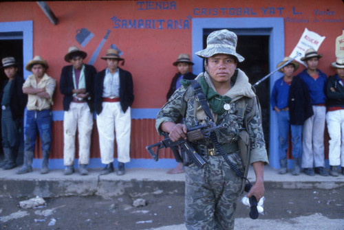 Armed soldier holding a field radio, Chajul, 1982