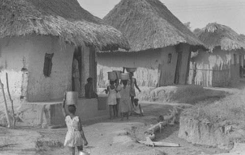 Girls carrying water, San Basilio de Palenque, Colombia, 1977