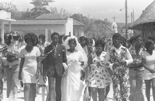 Wedding couple walking in the street, San Basilio de Palenque, 1975