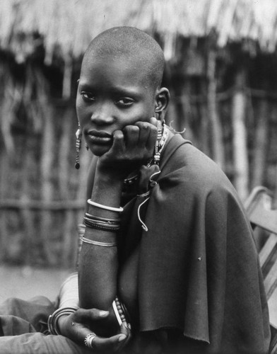 Woman near dwelling, Tanzania, 1979