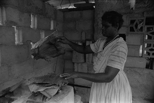 Woman preparing food, San Basilio de Palenque, 1976