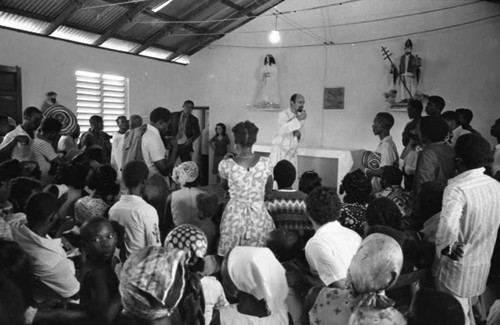 Priest preparing to celebrate a baptism, San Basilio de Palenque, 1975