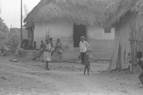 Man and woman standing outside a home, San Basilio de Palenque, 1976