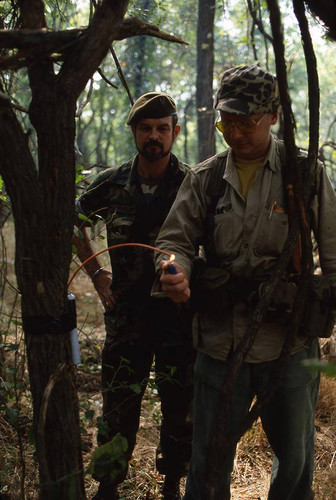 Survival school student learns about explosives, Liberal, 1982